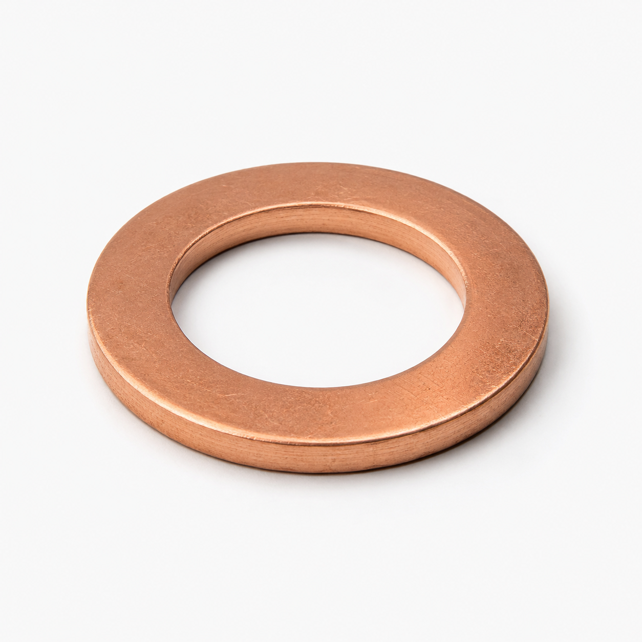 Generic copper oil drain plug crush washer on a clean studio background
